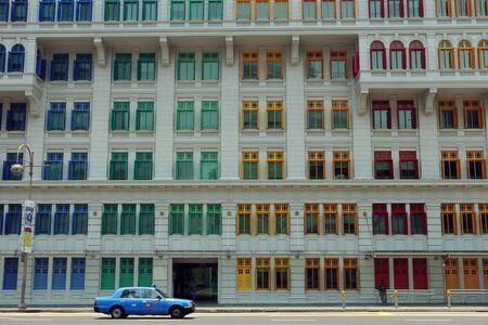 Colured window frames on a skyscraper building in Singapore.のeditorial素材