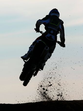 A motox rider goes for air off a big jumpの写真素材