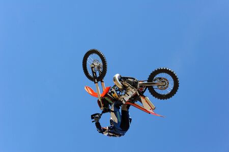 A dirt bike rider gets air during a stunt. の写真素材