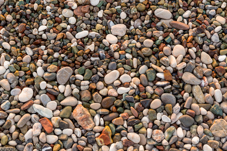 Sea beach of smooth and beautiful multi-colored stones.の写真素材
