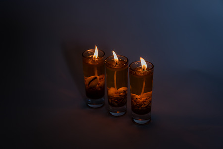 Three candles for decor and coziness in the house.の写真素材