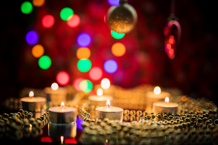 Toys for the new year. Christmas toy. Christmas toy. Toys on the Christmas tree. Christmas lights and candles.の写真素材