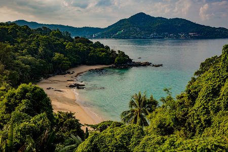 Beautiful seascape. Sea, mountains, sky, sunset and palm trees. Beautiful places of Phuket, Thailand.の写真素材