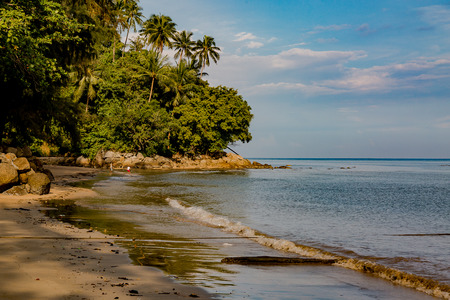 Beautiful seascape. Sea, mountains, sky, sunset and palm trees. Beautiful places of Phuket, Thailand.の写真素材