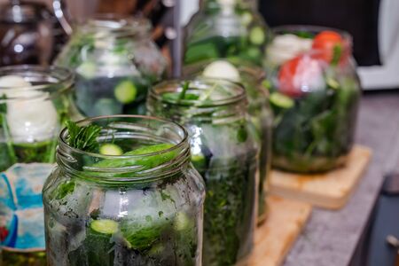 Pickles with herbs and spices. On a wooden background.の写真素材