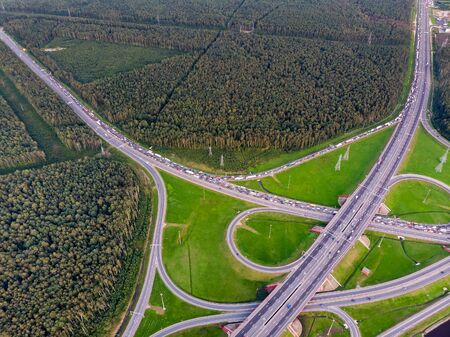 Road junction and congestion of cars. Panorama from the high.