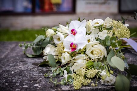 Beautiful bouquet of fresh flowers on a stone slab.の写真素材