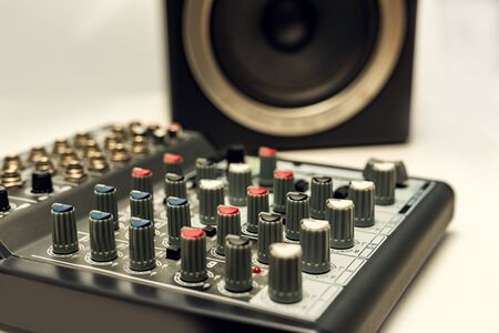 Close-up sound mixer detail for music mix. Remote for disco and audio.