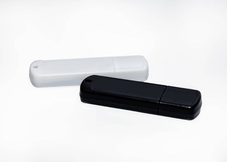 Two usb memory cards on a neutral background.