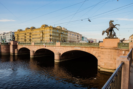 11.24.2019 city of St. Petersburg, Russia. Anichkov bridge with sculptures of horses and Sunny summer morning. The inscription on the bridge: the passage of ships is prohibited.のeditorial素材