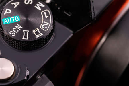 Macro close-up of the black body of the camera with buttons for control. Selective focus and a fragment of the framing.の写真素材