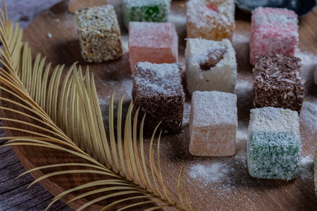 Oriental sweets on a wooden plate.の写真素材