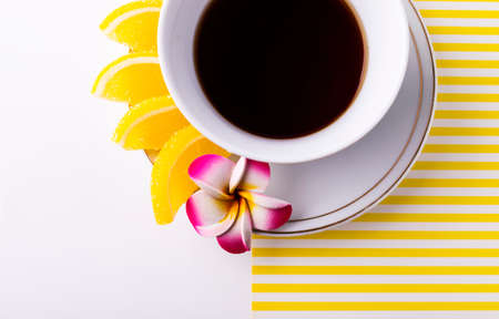 White tea Cup with lemon slices on a saucer, marmalade. Slices on a plate.の写真素材