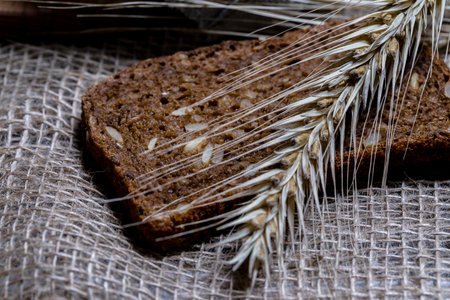 A piece of traditional village bread with an ear.の写真素材
