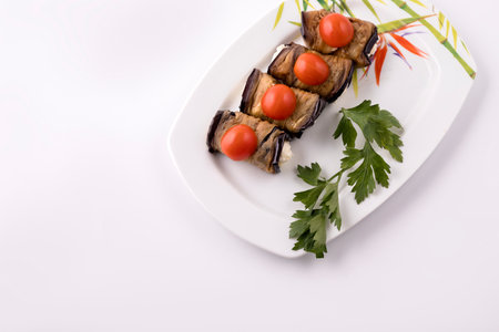 Eggplant rolls with cheese filling and tomatoes top view.の写真素材