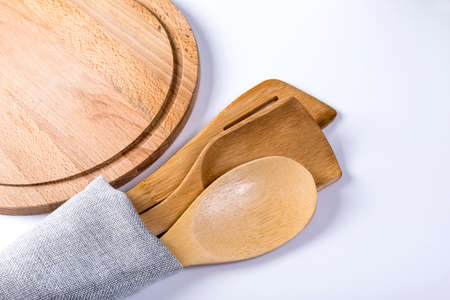 A set of kitchen utensils in a towel on the table