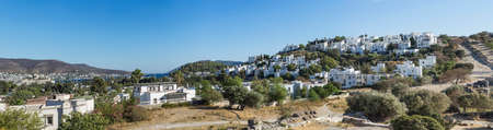 Landscape with a view of a small settlement with beautiful white houses on the mountainside.の写真素材