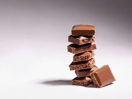 Brown chocolate with bubbles on a gradient background.の写真素材