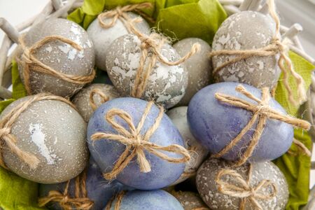 Colored grey and blue decorated Easter Eggsの写真素材