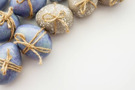 Colored grey and blue decorated Easter Eggsの写真素材