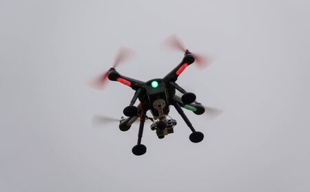 A  drone is ready to fly and hovered above the ground before the race.の写真素材