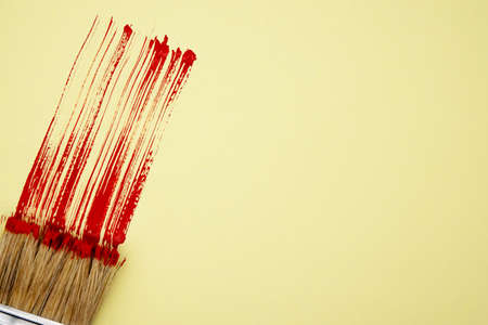 red streak of paint and brush. Valentine's day love. White background. copy space close up