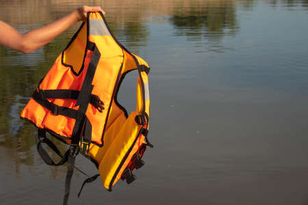 Red life-jacket. Necessary object for safe sailing.の写真素材