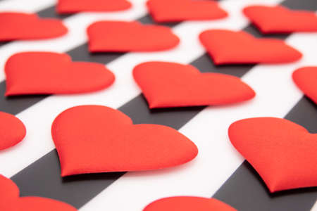 Valentine's day red hearts on a black and white backgroundの写真素材