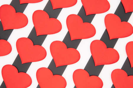 Valentines day red hearts on a black and white background car as a giftの写真素材