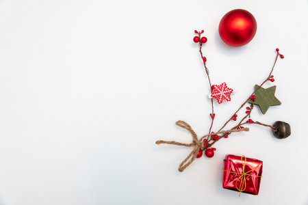 christmas gift with gold balls bow isolated on whiteの写真素材