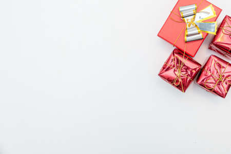 christmas gift with gold and red balls bow isolated on white background