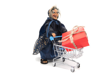 La befana, the traditional witch's costume for the epiphany holiday on whiteの写真素材
