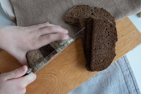 Concept of homemade bread, natural farm products, domestic production. Healthy and tasty organic food.の写真素材