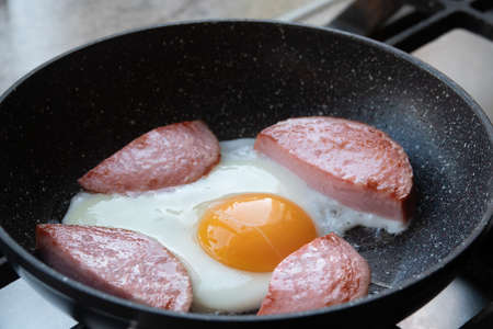 In the course of making breakfast with eggsの写真素材