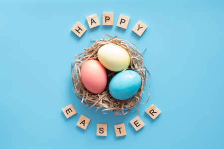 Easter eggs painted in pastel colors on blue. Easter concept