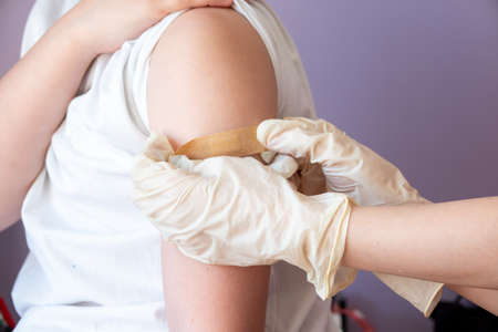 Children receiving vaccine at out side of the thigh.の写真素材