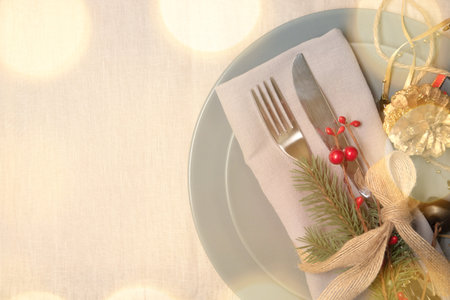 Christmas place setting with ribbon and christmas decorationsの写真素材