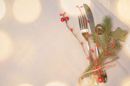 Christmas place setting with ribbon and christmas decorationsの写真素材