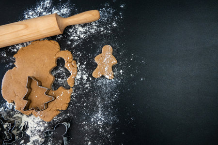 Children's hands make New Year's gingerbread cookies on a wooden table. New Year and Christmas concept.の写真素材