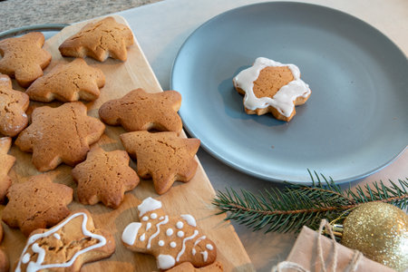 Children's hands make New Year's gingerbread cookies on a wooden table. New Year and Christmas concept.の写真素材