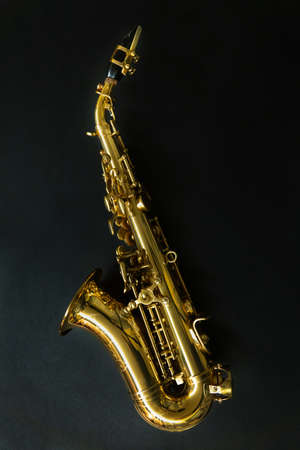 Saxophone jazz instruments. Soprano sax isolated. Saxophone music instrument closeup on blackの写真素材
