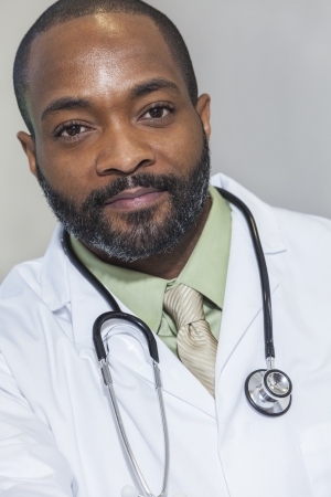 African American man male hospital doctor in white coat with stethoscopeの写真素材