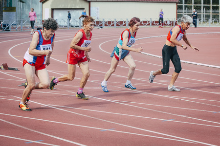 Chelyabinsk, Russia - August 28, 2015:  old women run 100 meters during championship of Russia on track and field athletics among the elderly, Chelyabinsk, Russia - August 28, 2015のeditorial素材