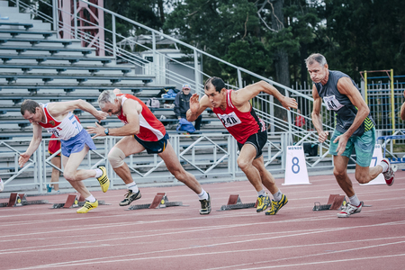 Chelyabinsk, Russia - August 28, 2015:  start of old men's 100 meters during championship of Russia on track and field athletics among the elderly, Chelyabinsk, Russia - August 28, 2015のeditorial素材