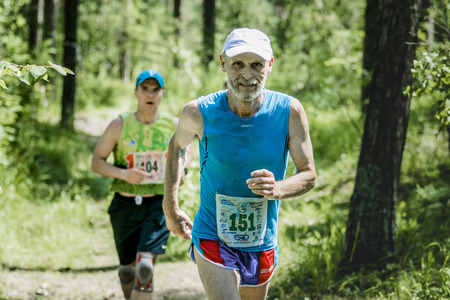 Miass, Russia - June 28, 2015: old man run during marathon "Running clean water-2015", Miass, Russia - June 28, 2015のeditorial素材