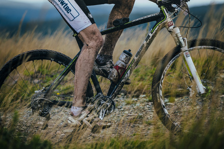 V.Ufaley, Russia - August 09, 2015:  foot and bicycle wheel in the mud during race "Big stone", V.Ufaley, Russia - August 09, 2015のeditorial素材