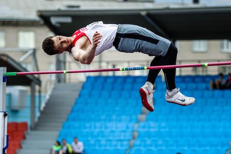 Chelyabinsk, Russia - may 15, 2015: Men athlete high jump during Championship of Chelyabinsk in...
