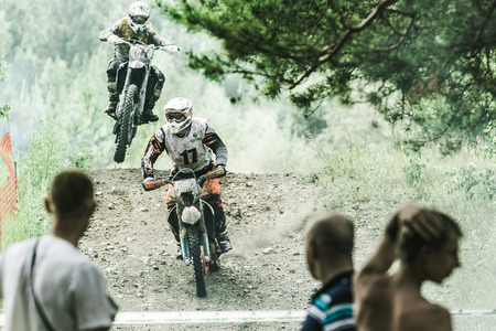 Kyshtym, Russia - June 21, 2015: A motocross driver competes during the race Urals Cup of Enduro...