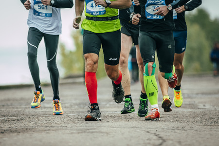 Omsk, Russia -  September 20, 2015: group of athletes running along the embankment during Siberian international marathonのeditorial素材