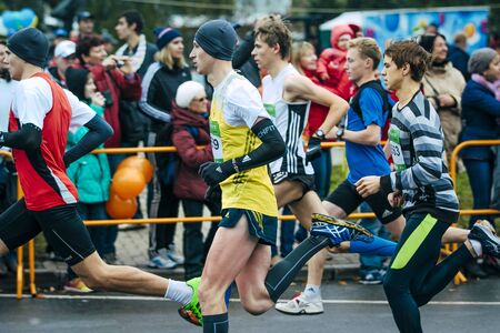 Omsk, Russia -  September 20, 2015: young athletes show high speed run from start during Siberian...